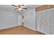 Bright bedroom featuring wood-look floors and built-in closet at 470 Lucille St, Bartow, FL 33830