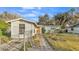 Front view of a house with a walkway and chain link fence at 470 Lucille St, Bartow, FL 33830