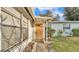 Light brown front door with a small window and walkway at 470 Lucille St, Bartow, FL 33830