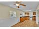 Kitchen with wood cabinets, white appliances and wood floors at 470 Lucille St, Bartow, FL 33830