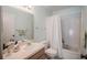 Bathroom with tub, shower, vanity, and white toilet at 4854 Colonnades Club Blvd, Lakeland, FL 33811