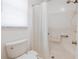 Clean bathroom featuring a shower stall with grab bar and white toilet at 4854 Colonnades Club Blvd, Lakeland, FL 33811