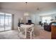 Bright dining area with table and chairs, open to living room at 4854 Colonnades Club Blvd, Lakeland, FL 33811