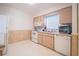 Clean kitchen featuring white appliances and wood cabinets at 4854 Colonnades Club Blvd, Lakeland, FL 33811