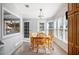 Sunlit dining area with wood table and chairs at 4938 Deerwood Dr, Lakeland, FL 33810