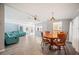 Spacious Living Room with Luxury Vinyl Plank Flooring, Ceiling Fan, French Doors, and Plenty of Natural Light at 4938 Deerwood Dr, Lakeland, FL 33810