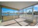 Screened porch with a beautiful view of the neighborhood pond and mature trees at 4938 Deerwood Dr, Lakeland, FL 33810