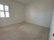 Bright bedroom with carpet flooring and plantation shutters at 516 Homecoming Way, Polk City, FL 33868