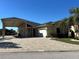 House exterior showcasing a paver driveway and landscaping at 516 Homecoming Way, Polk City, FL 33868