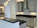 Kitchen details: granite countertops and gray cabinets at 516 Homecoming Way, Polk City, FL 33868