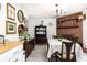 Mid-century modern dining room with brick fireplace and marble floor at 518 Boger N Blvd, Lakeland, FL 33803