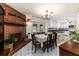 Spacious dining area with brick fireplace, chandelier, and marble flooring at 518 Boger N Blvd, Lakeland, FL 33803