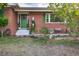 Brick home with a green door and inviting front porch at 518 Boger N Blvd, Lakeland, FL 33803