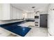 L-shaped kitchen with blue countertops and white cabinets at 518 Boger N Blvd, Lakeland, FL 33803