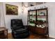 Relaxing living room corner with black recliner and shelving at 518 Boger N Blvd, Lakeland, FL 33803