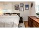 Main bedroom with mid-century furniture and gallery wall at 518 Boger N Blvd, Lakeland, FL 33803