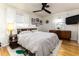 Mid-century modern bedroom with king bed and wood dresser at 518 Boger N Blvd, Lakeland, FL 33803