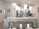 Kitchen features marble island with seating, stainless steel appliances, and modern lighting at 5536 Maddie Dr, Haines City, FL 33844