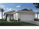 Single-story home with attached garage and landscaping at 5540 Maddie Dr, Haines City, FL 33844