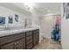 Bathroom with double vanity and shower/tub combo at 6046 Eagle Pointe Dr, Lakeland, FL 33812