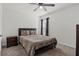 Well-lit bedroom with a double bed and nightstand at 6046 Eagle Pointe Dr, Lakeland, FL 33812