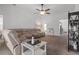 Relaxing living room featuring a large sectional sofa and a ceiling fan at 6046 Eagle Pointe Dr, Lakeland, FL 33812