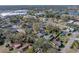 Aerial view showing home's location in a residential neighborhood at 702 Nw 1St Ave, Mulberry, FL 33860