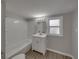 Clean bathroom with white vanity and shower/tub combo at 702 Nw 1St Ave, Mulberry, FL 33860