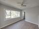 Cozy bedroom with large window and wood-look floors at 702 Nw 1St Ave, Mulberry, FL 33860