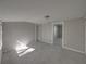 Spacious bedroom with neutral walls and carpet at 702 Nw 1St Ave, Mulberry, FL 33860