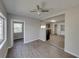 Bright dining area with wood-look floors and kitchen view at 702 Nw 1St Ave, Mulberry, FL 33860