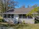 House exterior view with a screened porch at 702 Nw 1St Ave, Mulberry, FL 33860