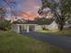 House exterior showcasing a carport and driveway at 702 Nw 1St Ave, Mulberry, FL 33860