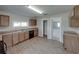 Modern kitchen with wood cabinets and new flooring at 702 Nw 1St Ave, Mulberry, FL 33860