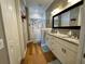 Double vanity bathroom with granite countertop at 708 Teaberry Trl, Polk City, FL 33868