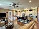 Open concept kitchen and living area at 708 Teaberry Trl, Polk City, FL 33868