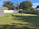 Spacious backyard with swing set and play area at 709 E Lowell St, Lakeland, FL 33805