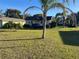 One-story house with a palm tree and large yard at 709 E Lowell St, Lakeland, FL 33805