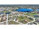 Gorgeous aerial view of neighborhood featuring pond and large lake at 751 Meandering Way, Polk City, FL 33868