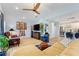 Comfortable living room with vaulted ceilings, recessed lights, and wood-look tile flooring at 751 Meandering Way, Polk City, FL 33868