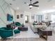 Living room with a unique geometric accent wall and comfortable seating at 7621 Sw 107Th Ln, Ocala, FL 34480