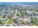 Aerial view of a single-Gathering home with a pool, located in a residential neighborhood at 813 Heron Pl, Winter Haven, FL 33884