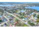 Aerial view of a home in a residential neighborhood near a lake at 813 Heron Pl, Winter Haven, FL 33884