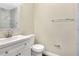 Clean bathroom with white vanity, shower, and modern fixtures at 813 Heron Pl, Winter Haven, FL 33884