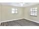 Bedroom with ceiling fan and grey vinyl flooring at 813 Heron Pl, Winter Haven, FL 33884