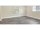 Simple bedroom with grey vinyl flooring and neutral walls at 813 Heron Pl, Winter Haven, FL 33884