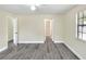 Main bedroom with ceiling fan, vinyl flooring, and access to bathroom at 813 Heron Pl, Winter Haven, FL 33884