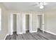 Bedroom with double closets and grey vinyl flooring at 813 Heron Pl, Winter Haven, FL 33884