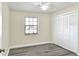 Bright bedroom with new flooring and large closet at 813 Heron Pl, Winter Haven, FL 33884