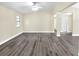 Bright living area with gray vinyl plank floors and neutral-toned walls at 813 Heron Pl, Winter Haven, FL 33884